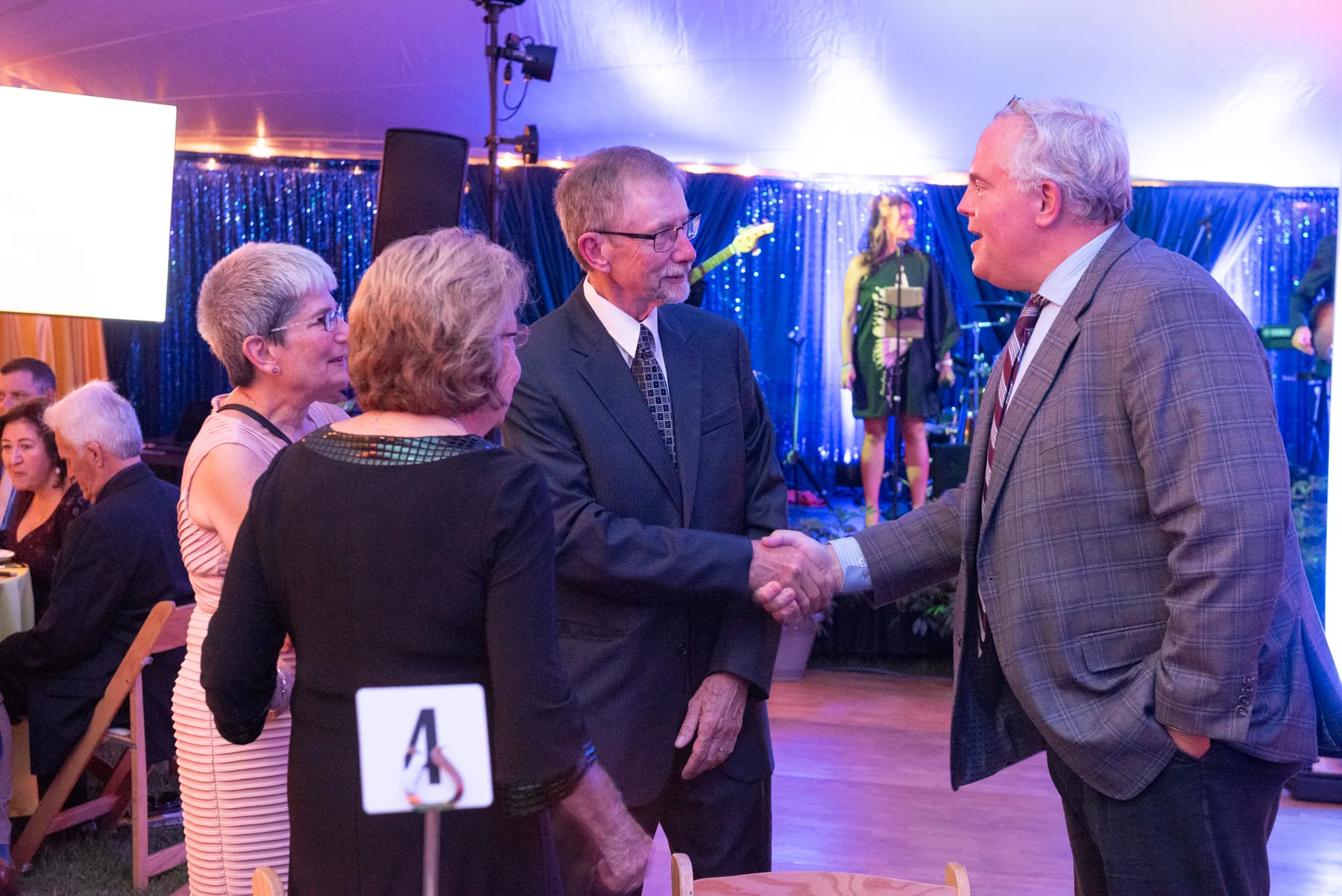 Guy shaking other guy hand