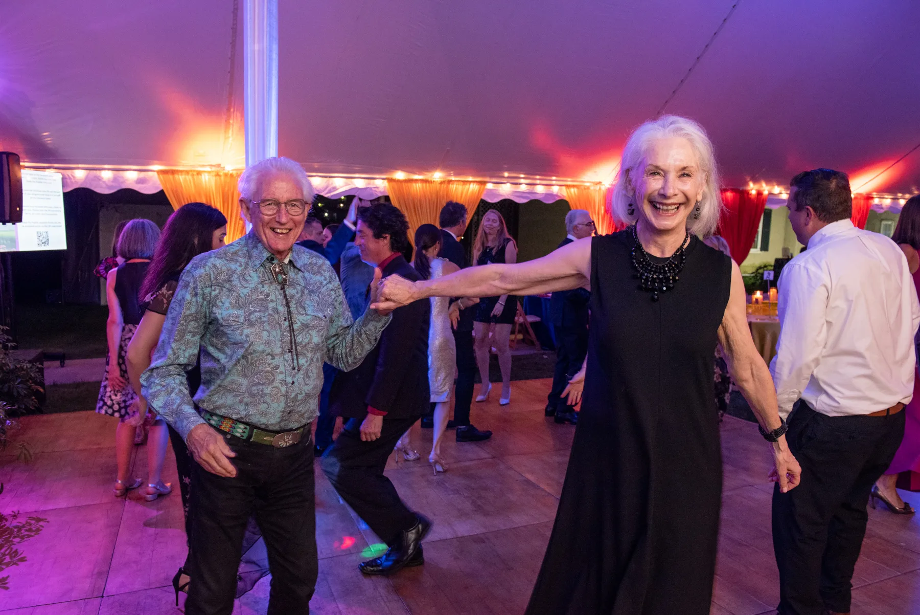 old couple enjoying a boat party